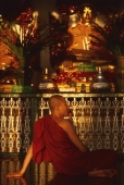 Myanmar (Burma), Yangon, Buddhist monk relaxing at Shwedagon Paya. - Martin Westlake