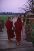 Myanmar (Burma), Mandalay, Buddhist monks crossing the U Bein bridge. - Martin Westlake