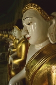 Myanmar (Burma), Sangaing Hills, Mandalay, Line of Buddha statues at Onhmin Thonze. - Martin Westlake
