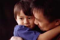 Young boy hugging his father - Mary Grace Long
