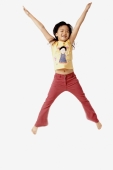 Girl jumping in the air with outstretched arms. - Erik Soh