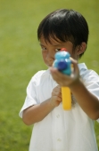 Young boy  playing with water gun - Alex Microstock02