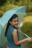Young girl holding an umbrella, looking over shoulder - Alex Microstock02
