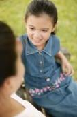 Young girl sitting down with her mother - Alex Microstock02
