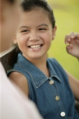 Young girl smiling, mother on foreground - Alex Microstock02