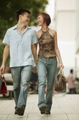 Couple walking in street, hand in hand - Alex Microstock02