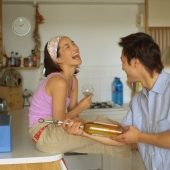 Couple in kitchen, laughing - Eckersley/Peacock