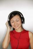 Young woman wearing headphones,  smiling - Alex Microstock02