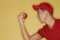 Young man holding a ball, side view - Alex Microstock02