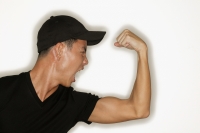 Young man flexing muscles, mouth open - Alex Microstock02