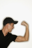 Young man flexing muscles, mouth open - Alex Microstock02