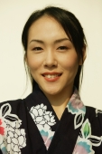 Young woman wearing a kimono, looking at camera, smiling - Alex Microstock02