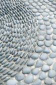 Close up of pebbles inlaid into floor - Jack Hollingsworth