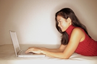 Woman using laptop, profile - Alex Microstock02