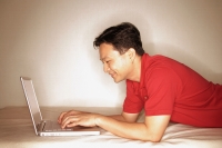 Man using laptop, profile - Alex Microstock02