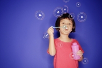 Young girl with bubble wand, blowing bubbles - Alex Microstock02
