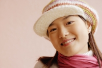 Young woman wearing cap, smiling - Alex Microstock02