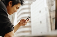 Young man using mobile phone - Alex Microstock02