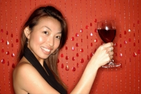 Woman holding wine glass, smiling - Alex Microstock02