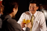 Two men toasting with beer. - Alex Microstock02