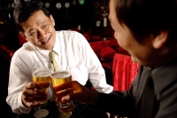 Two men face to face, holding beer glasses - Alex Microstock02