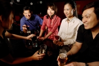 Couples drinking at bar, bartender serving them - Alex Microstock02