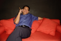 Man with cigar, lounging on sofa - Alex Microstock02