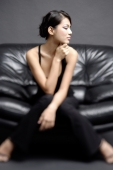  Young woman on chair, looking away - Alex Microstock02