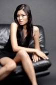  Young woman on chair, looking at camera, hands crossed - Alex Microstock02