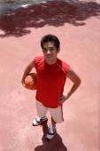 Man holding basketball, looking at camera - Alex Microstock02