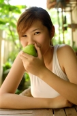 Woman eating apple, looking at camera - Alex Microstock02