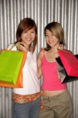  Young women holding shopping bags looking at camera - Alex Microstock02
