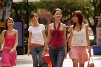Young women walking and carrying shopping bags - Alex Microstock02