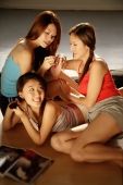 Young women applying nail polish and relaxing together - Alex Microstock02