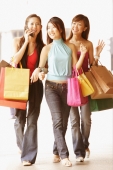 Young women with shopping bags, walking side by side - Alex Microstock02