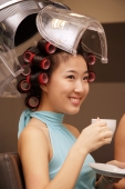 Young woman at beauty salon, drinking tea - Alex Microstock02