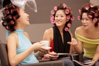 Young women at beauty salon, drinking tea and talking - Alex Microstock02