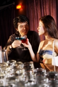 Young couple having drinks at night club - Alex Microstock02