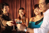 Couples toasting, woman looking at camera - Alex Microstock02