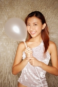 Young woman holding balloon, looking at camera - Alex Microstock02