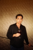 Young man, holding wine glass, looking away - Alex Microstock02