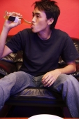 Young man drinking from beer bottle - Alex Microstock02