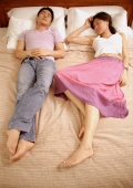 Couple sleeping on bed, side by side - Alex Microstock02