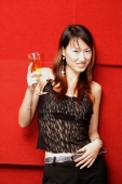Young woman holding champagne glass, looking at camera - Alex Microstock02