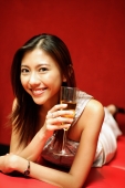 Young woman with champagne glass, smiling at camera - Alex Microstock02