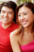 Couple sitting side by side, toothy smiles - Alex Microstock02