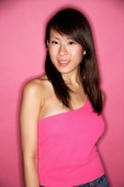 Young woman in pink top against pink background - Alex Microstock02
