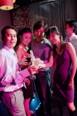 Young adults in club, looking at camera, holding drinks - Alex Microstock02