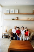 Two generation family, sitting in living room, looking at camera - Jade Lee
