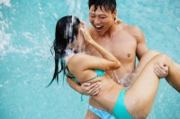 Man carrying woman in bikini - Jade Lee